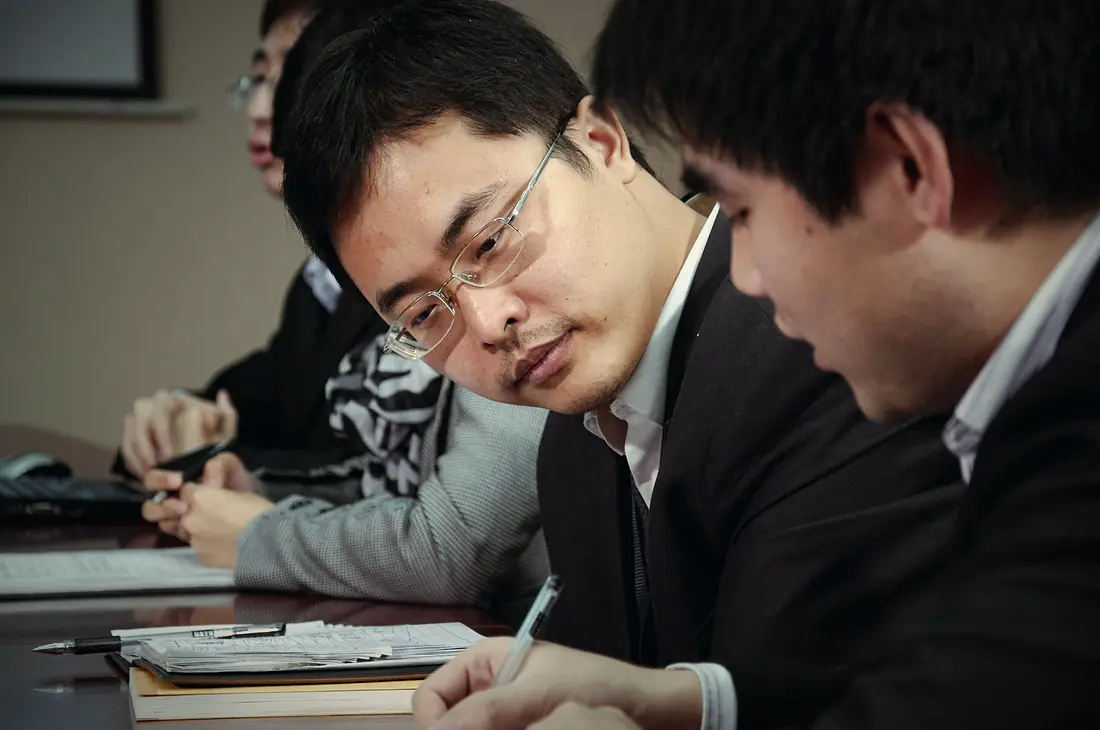 Consultants reviewing documents together